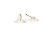 Tiny pearl stud earrings featuring small, lustrous pearls set on delicate posts, adding a subtle and elegant touch to any outfit.
